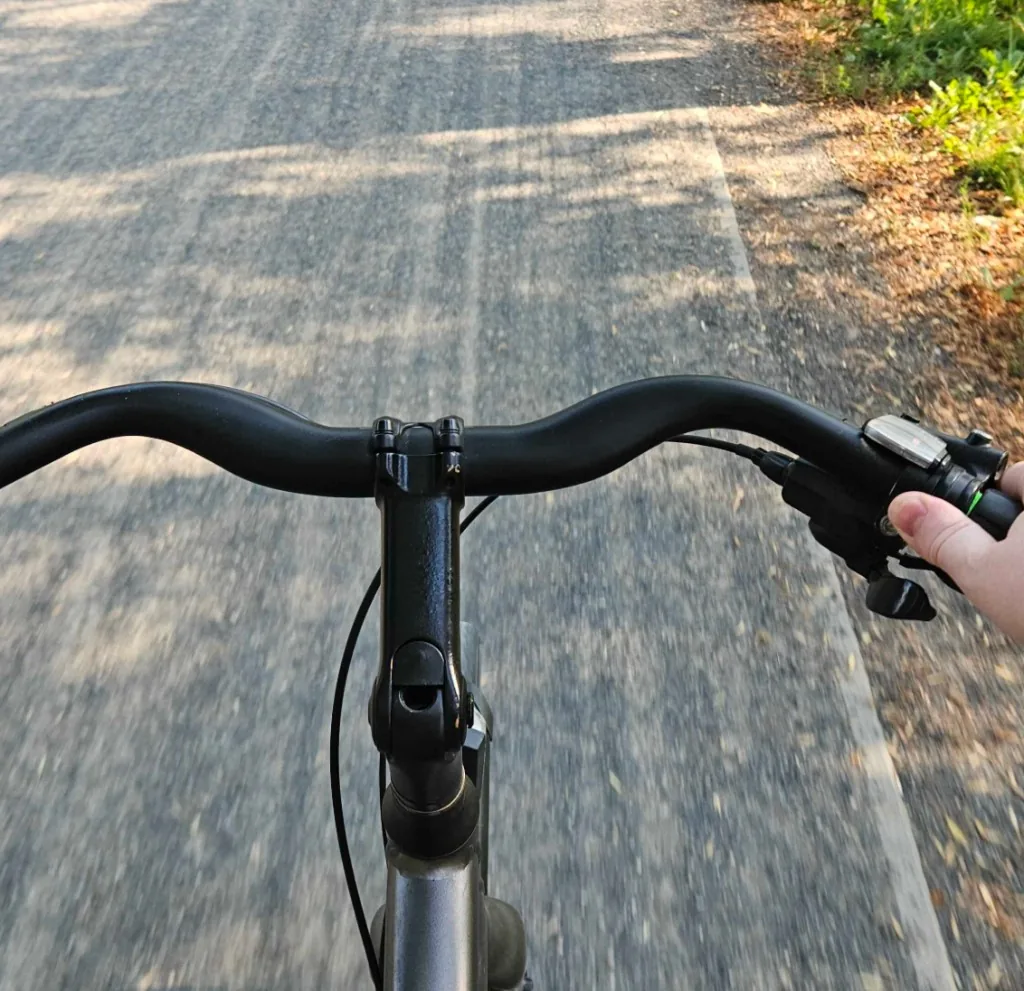 Riding home, one hand on the bars